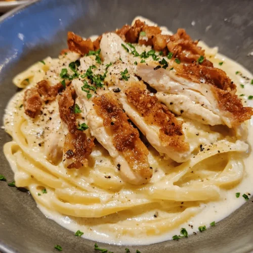Chicken Carbonara is a delightful twist on the classic Italian dish that has captured the hearts and taste buds of food lovers around the world. Traditionally made with guanciale, Pecorino Romano cheese, and a silky egg sauce, Carbonara is known for its rich, creamy texture and robust flavors. This recipe takes a beloved comfort food and elevates it by incorporating tender chicken, making it a hearty and satisfying meal perfect for busy weeknights or cozy gatherings.