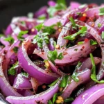 Zesty Sumac Onions are a vibrant and flavorful side dish that can transform any meal into an extraordinary culinary experience. This dish showcases the unique tartness of sumac, a spice deeply rooted in Middle Eastern cuisine, and pairs it beautifully with the sweet crunch of red onions. Whether served alongside grilled meats, fresh salads, or Mediterranean platters, Zesty Sumac Onions add a refreshing twist that complements a wide range of dishes.