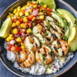 Dive into the vibrant and satisfying world of seafood with our Grilled Shrimp Bowl featuring Avocado, Corn Salsa, and a luscious Creamy Garlic Sauce. This dish harmoniously combines fresh ingredients and bold flavors, making it perfect for a summer meal, weeknight dinner, or even a festive gathering. The succulent shrimp, paired with the creamy richness of avocado, the sweetness of corn, and the zesty punch of garlic sauce, creates a delightful experience for the palate.