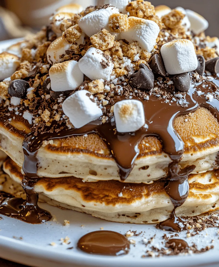 Are you ready to elevate your breakfast game? Imagine a stack of fluffy pancakes infused with the nostalgic flavors of campfire s'mores, a delightful treat that combines the sweetness of chocolate, the gooeyness of marshmallows, and the crunch of graham crackers. The S’mores Pancakes Delight recipe is not just a breakfast dish; it’s an experience that brings together the joy of outdoor adventures and the comforts of home. Perfect for family gatherings, casual brunches, or simply a cozy weekend treat, this recipe will transport you back to carefree summer nights spent around the fire, savoring every bite of melted chocolate and toasted marshmallows.